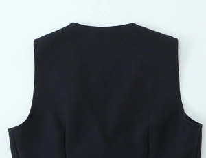 Close-up of black sleeveless vest collar and back shoulder stitching detail