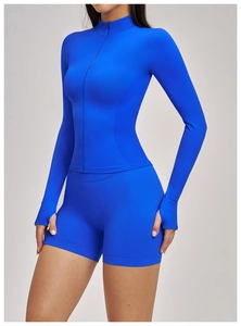 Close-up of klein blue slim-fit zip-up yoga jacket featuring thumbhole cuff design