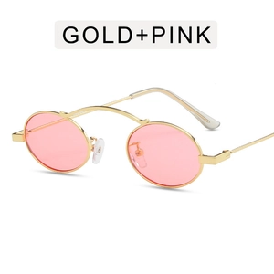 Punk style oval sunglasses with gold metal frame and pink ocean lenses on white background