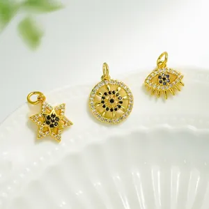 Exquisite 18K gold plated bird and star charms with inlaid zircon on white ceramic plate