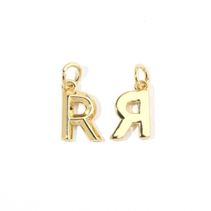 Detailed macro view of 18K gold plated letter R charms with cubic zirconia stones
