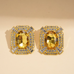 Boucles d'oreilles vintage dorées avec grand cristal jaune et bordure de strass