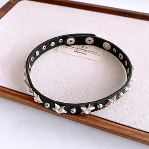 Punk black leather choker necklace with silver studs and rhinestone star accents