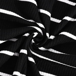 Macro shot of high-elastic black and white striped rib knit fabric texture and softness