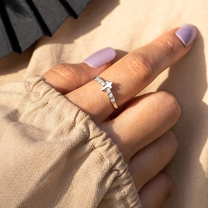 S925 sterling silver cross ring with sparkling cubic zirconia on a female hand