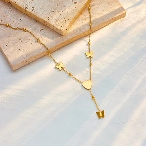 Elegant gold titanium steel necklace featuring heart and butterfly charms on a bead chain