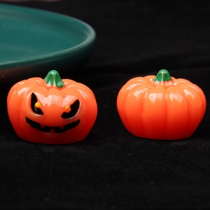 Set of two miniature 3D luminous Halloween pumpkins made of resin with glowing effect