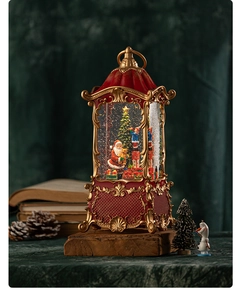 Close-up of vintage Christmas lantern music box with Santa Claus and festive tree interior