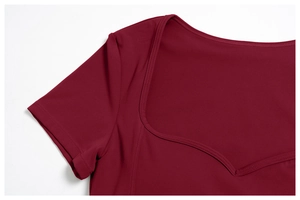Detail of sweetheart neckline and premium stitching on burgundy yoga top