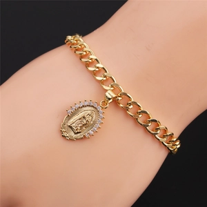 Wrist view of a gold-plated Cuban link bracelet featuring a Virgin Mary zircon pendant