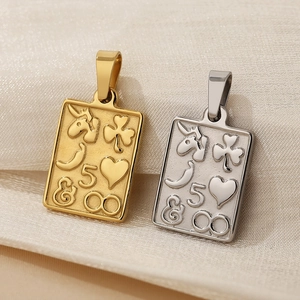 Detailed macro view of gold and silver sun moon pendants with embossed symbolic patterns