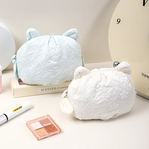Cute cat-ear lace makeup pouch in light blue and white colors for daily skincare storage