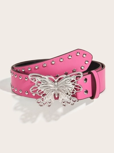 Detail of pink leather belt featuring a large silver butterfly buckle and rivet accents