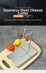 Close-up of stainless steel cheese slicer featuring precise 1-13cm scale on metal base