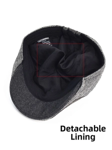 Detail of herringbone flat cap with independent black lining and wool blend fabric