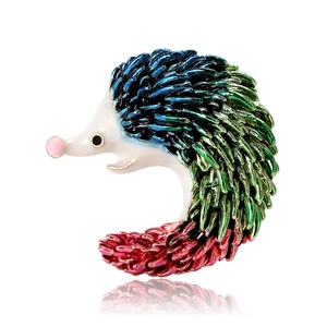 Vintage hedgehog enamel brooch with colorful blue green and red gradient spines