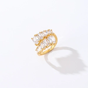 Detailed view of gold ring featuring double-row baguette crystal stones in prong setting