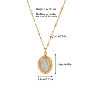 Detail view of gold titanium necklace showing shell pendant dimensions 1.6cm x 1.1cm