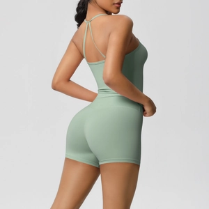 Detail view of sage green yoga set with criss-cross back straps and high waist shorts