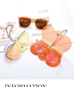 Detail view of butterfly shaped sunglasses pouches with stylish metal ball chains