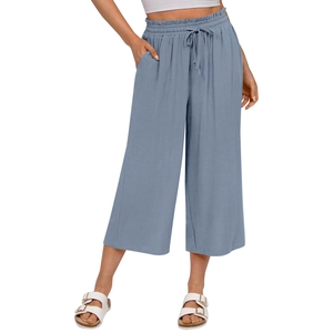 Detail view of blue-grey linen wide-leg trousers featuring high-waisted drawstring design