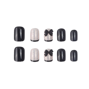 Faux ongles noirs et pailletés argentés avec des nœuds 3D élégants en relief