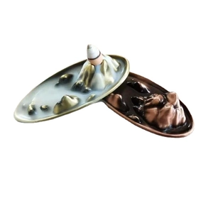 Mountain landscape backflow incense burner in antique bronze and red copper finishes