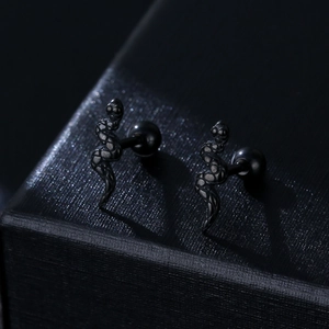 Punk 316L stainless steel snake stud earrings in matte black finish on jewelry box