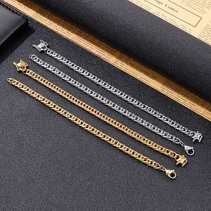 Golden and silver stainless steel 6.5mm Cuban link bracelets for men on vintage paper