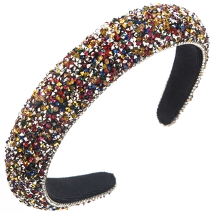 Detailed close-up of colorful rhinestones on wide padded headband with soft black velvet lining
