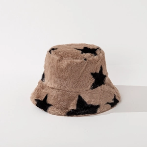 Close-up of brown plush bucket hat with black star patterns showing soft faux fur texture