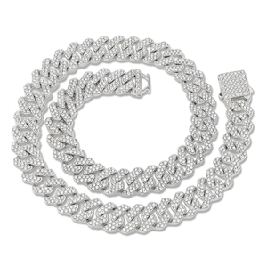 Detailed close-up of iced out silver Cuban link chain with square rhinestone clasp