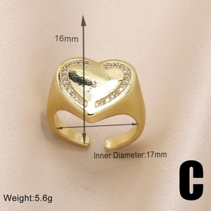 Detail of gold heart ring with cubic zirconia showing 17mm inner diameter and 5.6g weight