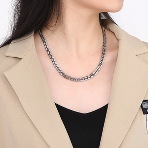 Hip-hop style silver curb chain necklace for men shown on a model in street style