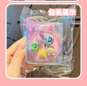 Detailed view of pink cartoon fishing game keychain packaged in a transparent poly bag