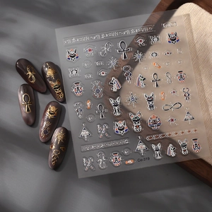 Golden Egyptian cat nail art stickers featuring Bastet and Eye of Horus symbols