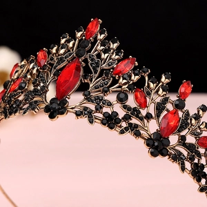 Close-up of Baroque bridal crown with red rhinestones and vintage bronze metal work