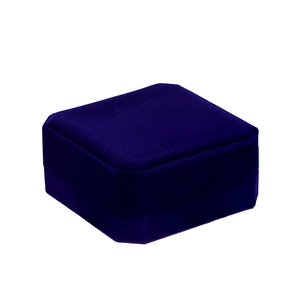 Macro shot of dark purple velvet jewelry box featuring a square shape with angled edges