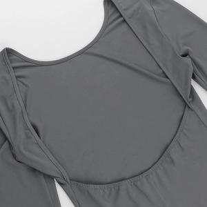 Detail view of the deep backless U-neckline and gray high-stretch fabric of the bodysuit