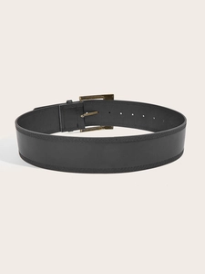 Detail of wide black leather belt with a bronze square buckle and double stitching
