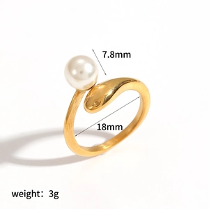 Detailed macro view showing the 7.8mm pearl and golden snake texture on this chic ring