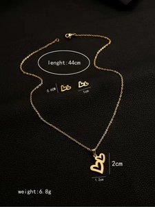 Detailed view of gold heart jewelry set dimensions with necklace and stud earrings