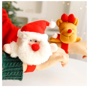 Detail of plush Christmas slap bracelets with Santa and reindeer on a wrist