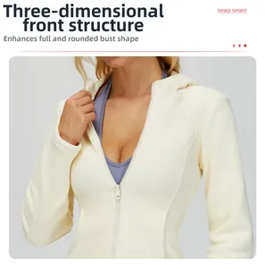 Detail showing the cream slim-fit hoodie with a front zipper and structural seam lines