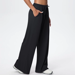 Detailed view of women's black wide leg yoga pants with drawstring and side pocket detail