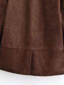 Detail of dark brown faux suede fabric showing premium texture and refined hem stitching