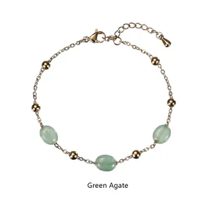Close-up of golden stainless steel bracelet with green agate stones and lobster clasp