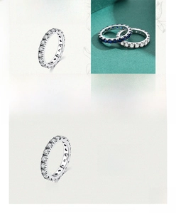 Detailed close-up of 925 sterling silver eternity rings featuring blue and white zircons