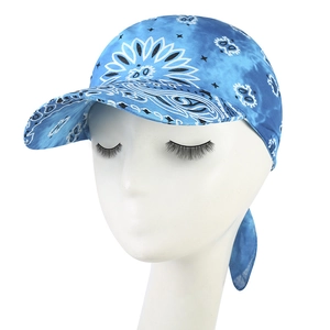 Detailed view of blue paisley print and fabric texture on a fashion sun baseball cap