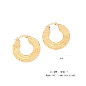 Detailed view of 3cm stainless steel chunky hoop earrings with wavy texture